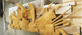 Detail of the eagle atop pikes and muskets at the top of the frame